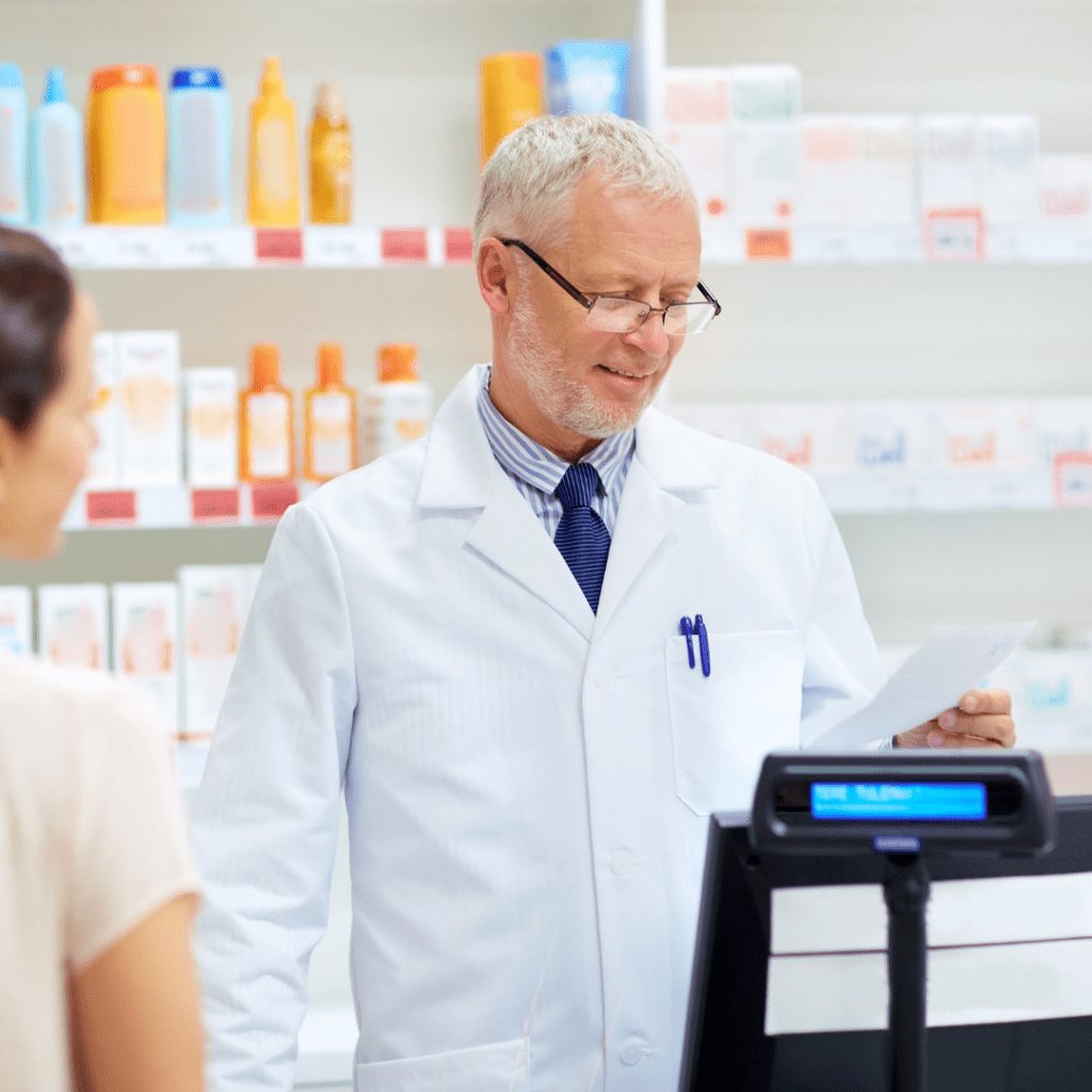 pharmacist reading a thank you note prescription and smiling  